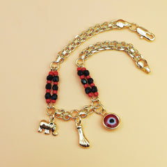 Gold-Tone Chain Bracelet with Red and Black Beads, Elephant Charm, Feather Pendant, and Round Stone Accent – 19 cm Length