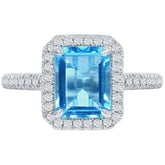 18KT White Gold 0.24ctw Round Diamond Halo Blue Topaz Ring