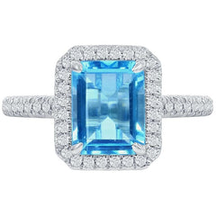18KT White Gold 0.24ctw Round Diamond Halo Blue Topaz Ring